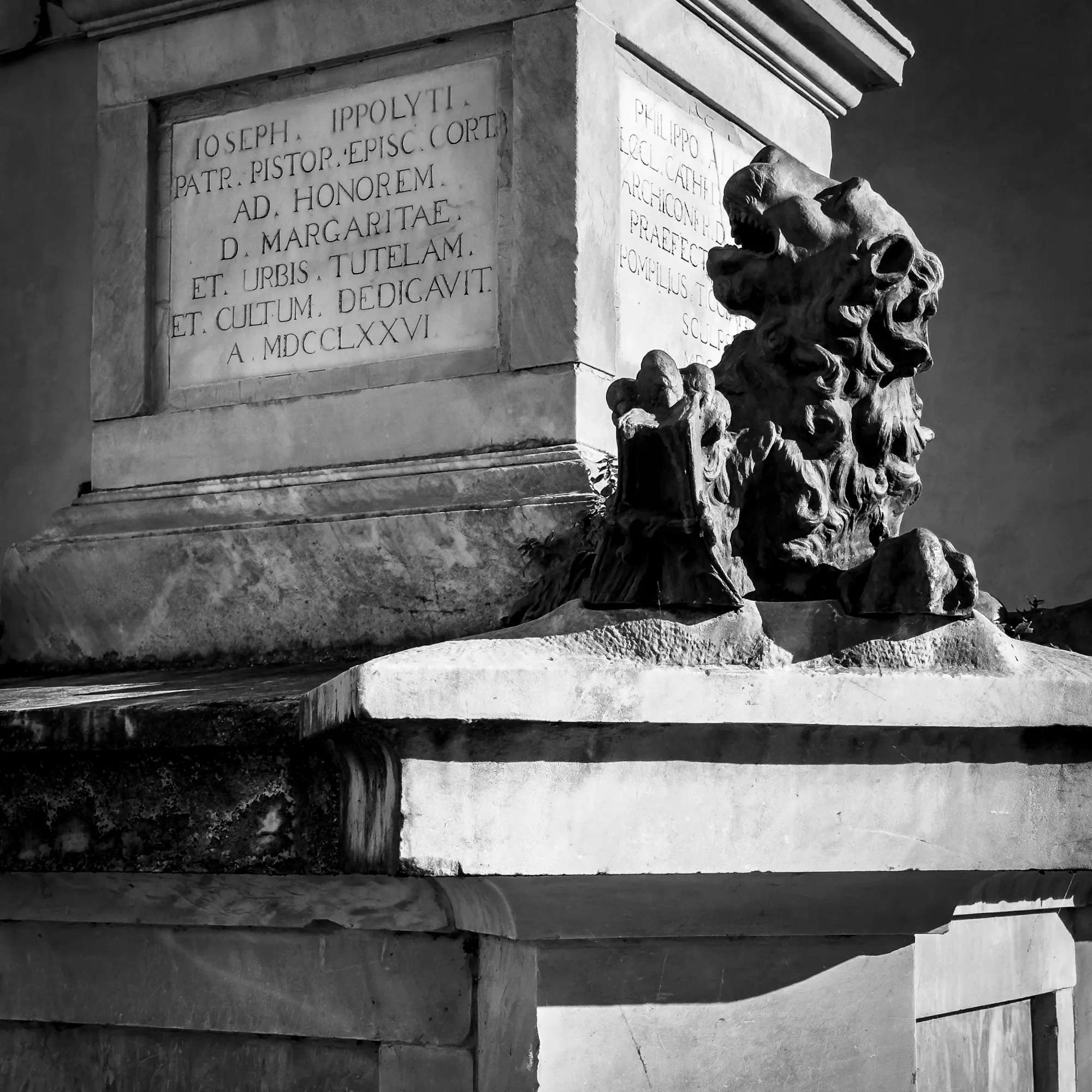 Monochromatic digital photograph of a detail of the monument to Santa Margherita in Cortona, Italy.