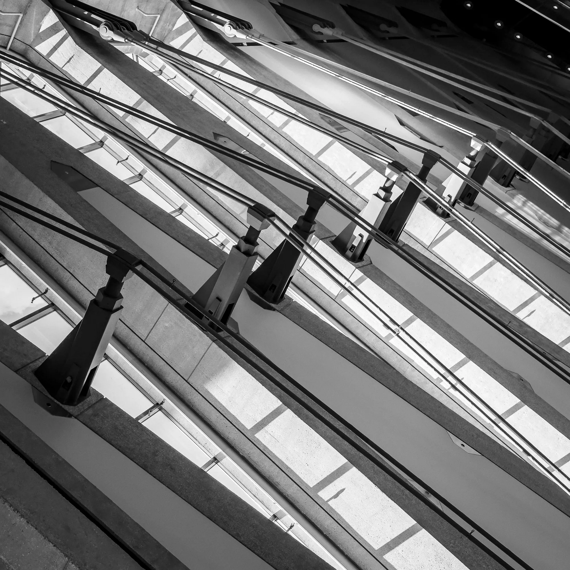 Monochromatic digital photograph of support cables on the ceiling of Dulles International Airport in Virginia. 